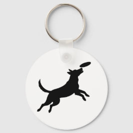Llavero perro saltando para atrapar un frisbee