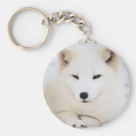 Llavero Pezón ártico blanco en la nieve