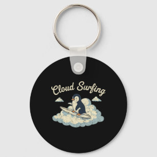 Llavero Pingüino de Surf en Nubes - Diversión Caprichosa d