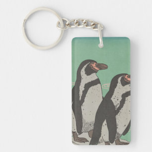 Llavero Pingüinos junto al agua