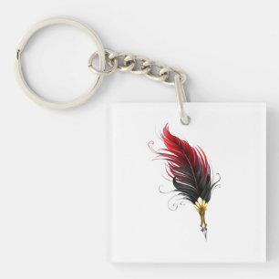 Llavero Pluma de plumas rojas con nido de oro