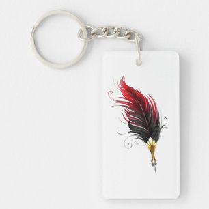 Llavero Pluma de plumas rojas con nido de oro