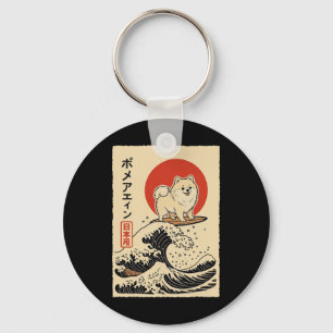 Llavero Pomerania surfeando ola japonesa