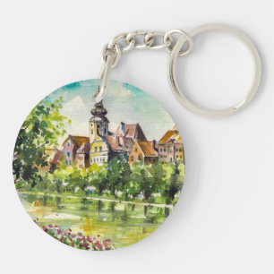 Llavero Primavera en pequeña ciudad en el río