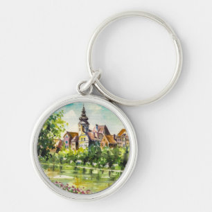 Llavero Primavera en pequeña ciudad en el río