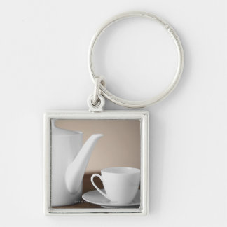 Llavero Primer de una taza y de un platillo con una
