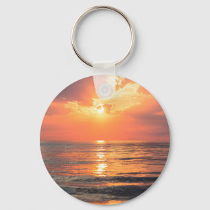 Llavero puesta de sol sobre el agua