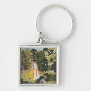 Llavero Radha y Krishna que caminan en una arboleda