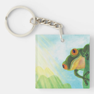 Llavero Rana verde atrapando rayos solares