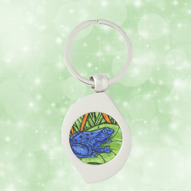 Llavero Rana vibrante de veneno azul (Blue poison Frog on green lily pad with yellow reeds grass on keychain.)