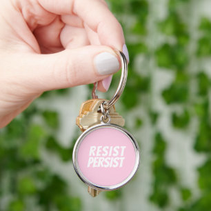 Llavero "resistir persistir" blanco rosa claro
