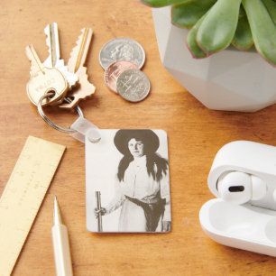 Llavero Retrato fotográfico de una vaquera sosteniendo un 