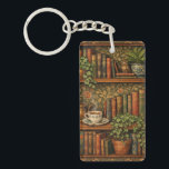 Llavero Retro book lover art<br><div class="desc">A cozy retro-inspired design featuring a charming bookshelf filled with vintage books,  delicate botanical accents,   and a comforting cup of tea or coffee.</div>