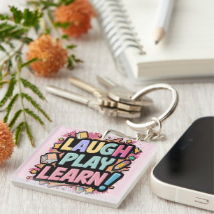 Llavero Ríe, juega, aprende rosa