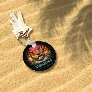 Llavero Ronda Escape Tropical del Gato Genial Soñador