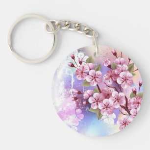 Llavero Sakura rosa sobre fondo de pintura