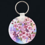 Llavero Sakura rosa sobre fondo de pintura<br><div class="desc">Dibujado artísticamente,  rama de rosa,  flores de cerezo sobre fondo pintoresco,  texturizado,  pintado con pintura blanca,  rosa y azul. Pink Sakura</div>