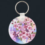 Llavero Sakura rosa sobre fondo de pintura<br><div class="desc">Dibujado artísticamente,  rama de rosa,  flores de cerezo sobre fondo pintoresco,  texturizado,  pintado con pintura blanca,  rosa y azul. Pink Sakura</div>