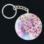Llavero Sakura rosa sobre fondo de pintura<br><div class="desc">Dibujado artísticamente,  rama de rosa,  flores de cerezo sobre fondo pintoresco,  texturizado,  pintado con pintura blanca,  rosa y azul. Pink Sakura</div>