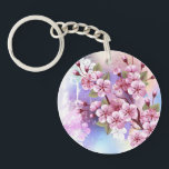 Llavero Sakura rosa sobre fondo de pintura<br><div class="desc">Dibujado artísticamente, rama de rosa, flores de cerezo sobre fondo pintoresco, texturizado, pintado con pintura blanca, rosa y azul. Pink Sakura</div>