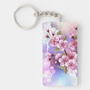 Llavero Sakura rosa sobre fondo de pintura