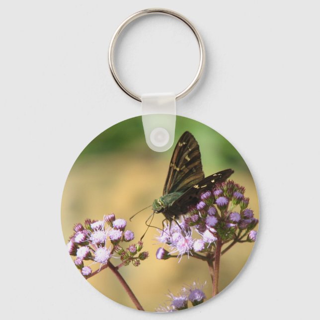 Llavero Saltador de cola larga en cadena de flores húmedas (Anverso)