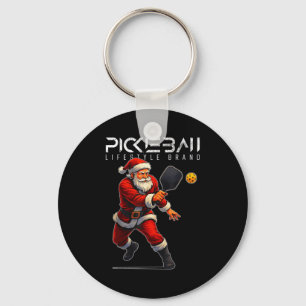 Llavero Santa pickleball bateando con la paleta navidad va
