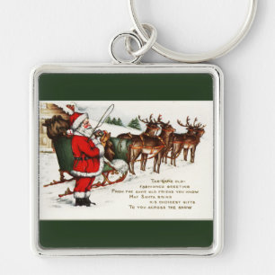 Llavero Santa y Sleigh con verde reno