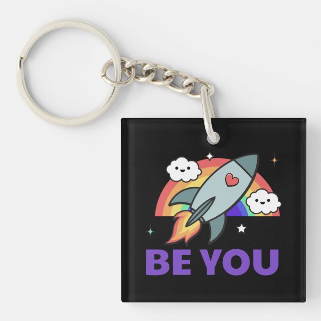 Llavero Sé tú. Nubes de cohetes arcoiris con corazón (Frente)