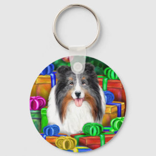Llavero Sheltie Navidades abren regalos azul Merle