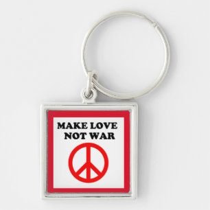 LLAVERO SIGNO DE PAZ "HACER EL AMOR NO LA GUERRA"