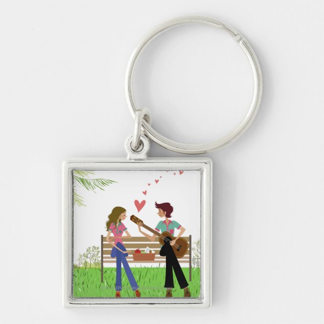 Llavero Sirva tocar la guitarra con una mujer al lado de (Frente)
