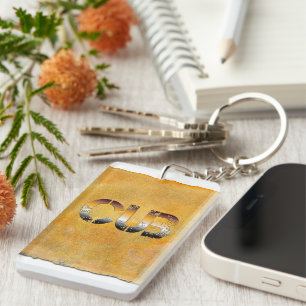 Llavero SlipperyJoe's cub word naranja-tonos marrones pro