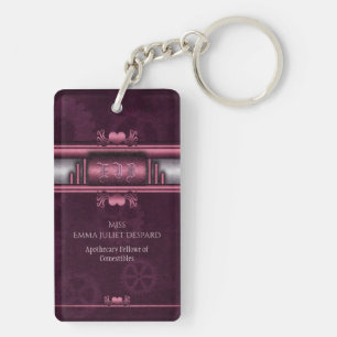 Llavero Steampunk, corazones rosados en marcha con monogra