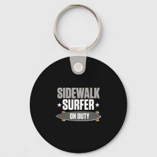 Llavero Surfeo en acera con longboard Surfear con longboar