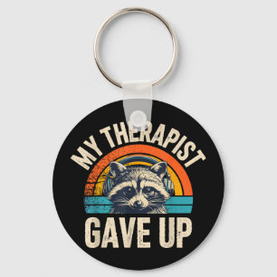 Llavero Terapeuta abandonó mapache con auriculares retro