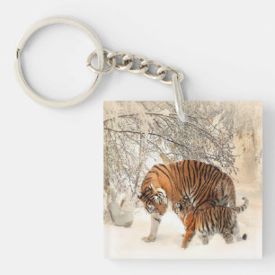 Llavero tigres en la nieve