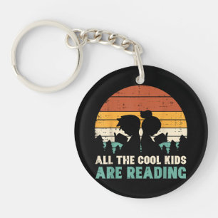 Llavero Todos los niños están leyendo el libro de lectura
