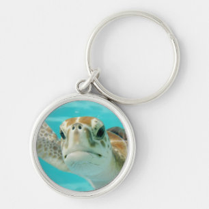 Llavero Tortuga marina nadando en aguas turquesas