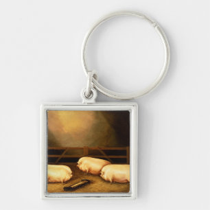 Llavero Tres cerdos premiados fuera de una pocilga