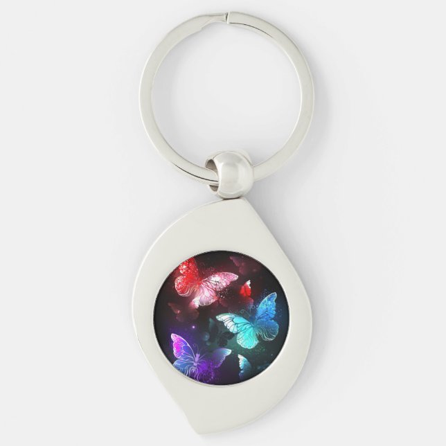 Llavero Tres mariposas brillantes en el fondo nocturno (Anverso)