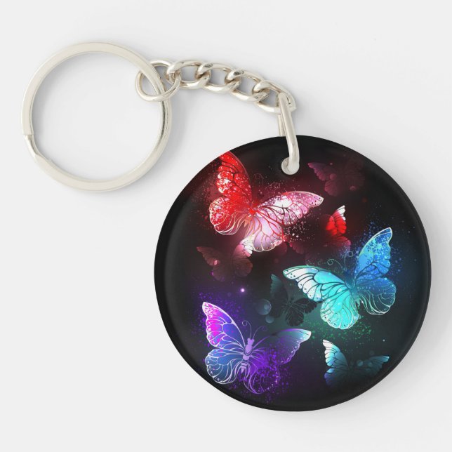 Llavero Tres mariposas brillantes en el fondo nocturno (Frente)