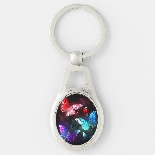 Llavero Tres mariposas brillantes en el fondo nocturno (Anverso)