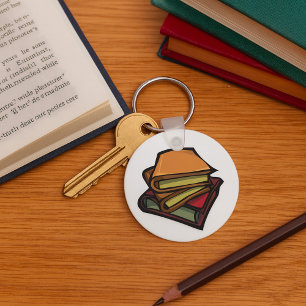 Llavero Tres viejos libros apilados juntos