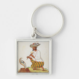 Llavero Un encantador de serpiente indio con una cobra, de