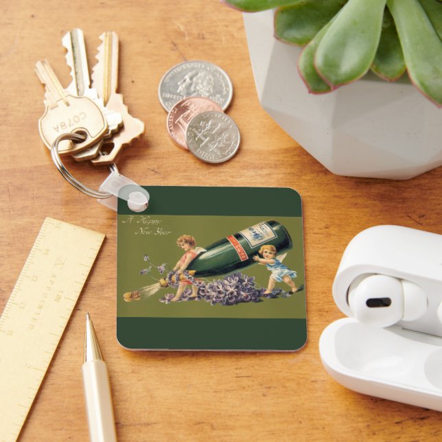 Llavero Un feliz año nuevo, ángeles de época con champán (Escritorio )