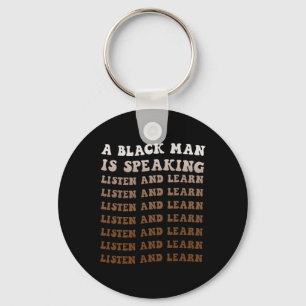 Llavero Un hombre negro está hablando Escucha y aprende ne