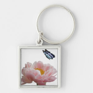 Llavero un peony rosado grande es visitado por un etéreo