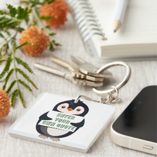 Llavero Un pingüino sosteniendo un cartel con texto person