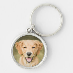 Llavero Un retrato de un perrito del golden retriever